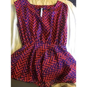 Peplum red and blue blouse with peak a boo back